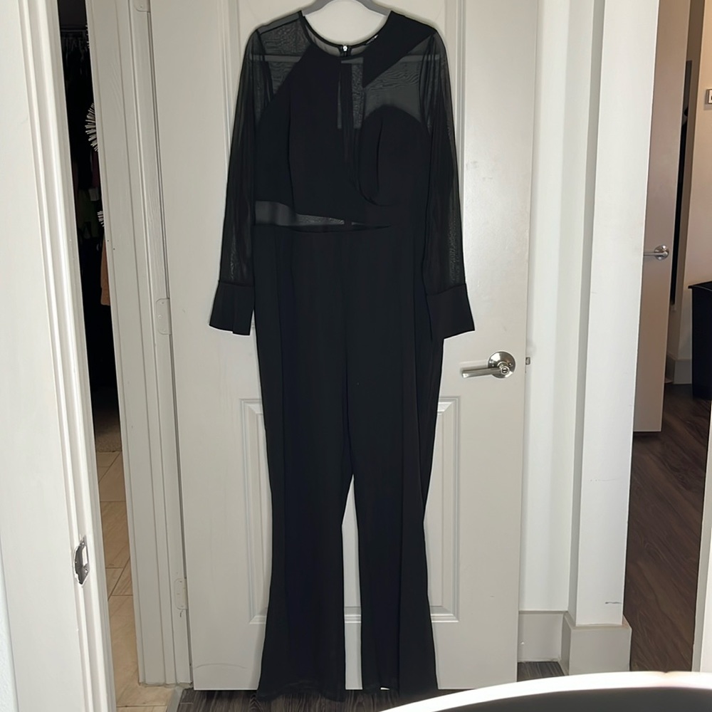 Ladies Zip Up Jumpsuit With A Hint Of Sheer. - image 1